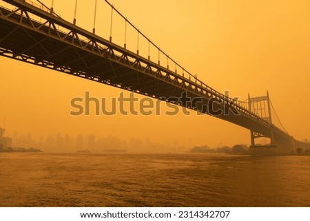 The Triborough Bridge along the East River in New York City with Massive Air Pollution from Wildfires Royalty-Free Stock Photo #2314342707