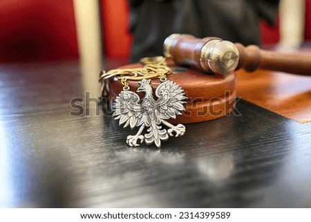 06.07.2023 wroclaw, poland, Polish court trial law insignia lies on the bench. Royalty-Free Stock Photo #2314399589