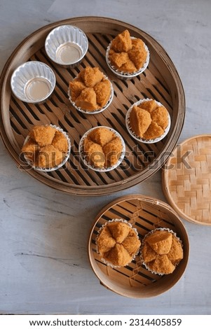 Popular Chinese pastry. Fa Gao aka Prosperity Cake. Color comes from brown sugar and the Chinese character in the red packet symbolised "prosperity" Royalty-Free Stock Photo #2314405859