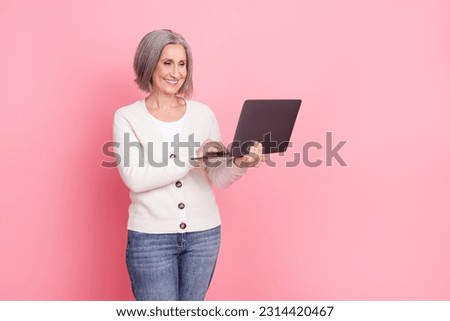 Full size photo of senior woman netbook instagram twitter facebook telegram wear trendy white clothes isolated on pink color background Royalty-Free Stock Photo #2314420467