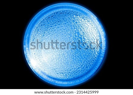 ice texture blue light ball on black background .