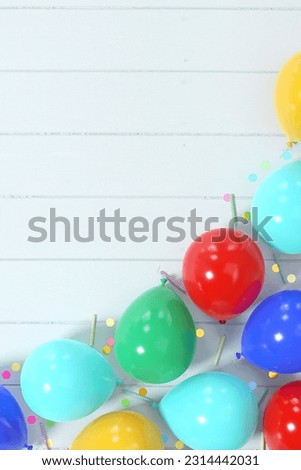 Colorful balloons with round confetti and birthday candles corner border composition