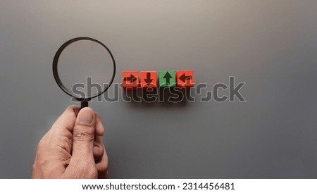 Magnifying glass and arrow. Looking for a right direction, moving forward concept Royalty-Free Stock Photo #2314456481