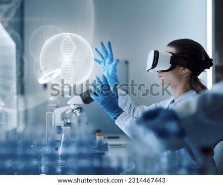 Scientist wearing a VR headset and interacting with virtual reality in the science lab Royalty-Free Stock Photo #2314467443