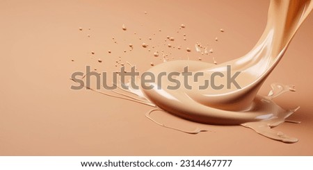Liquid foundation splashing on light clean background, Close-up of isolated make-up smudges or beige skin care fluid Royalty-Free Stock Photo #2314467777