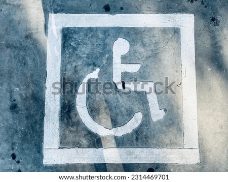 Sign of handicapped in the ground