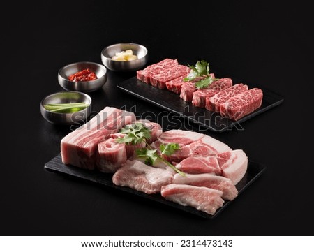 Korean bbq, raw pork and beef dish on the table Royalty-Free Stock Photo #2314473143