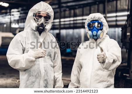 Scientist wear Chemical protection suit check danger chemical, working at dangerous zone. Healthcare workers wearing hazmat suits working together to control an outbreak Royalty-Free Stock Photo #2314492123