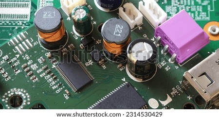 High tech banner with microchip. Inductor and Semiconductor components on electronic circuit board.  Royalty-Free Stock Photo #2314530429