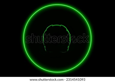 Helmet outline with neon green light ring