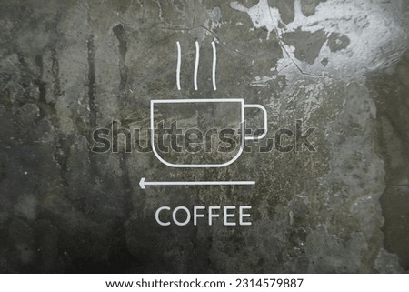 Coffee logo or icon on the wall of a coffee shop or cafe