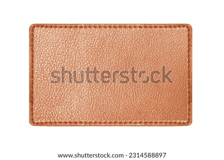 Brown leather belt strap closeup isolated on white. Brown stitched leather seam frame label tag isolated on white. Empty copy space fashion background. Textile frame cutout. Royalty-Free Stock Photo #2314588897