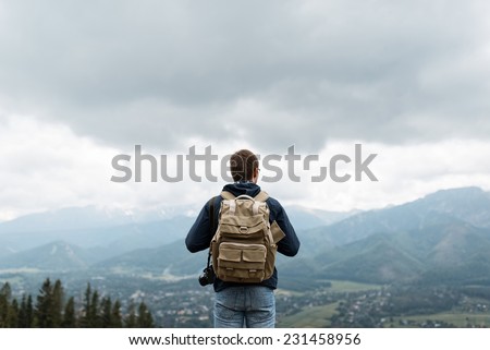 Male traveler from back in the mountains