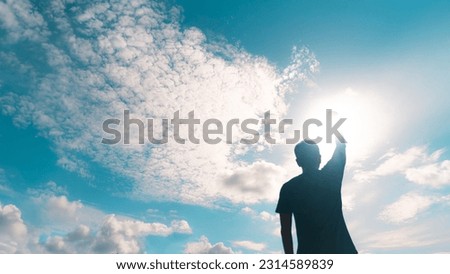 Man rise hand up to amazing blue sky feel never give up and freedom. Royalty-Free Stock Photo #2314589839