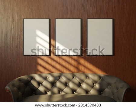 stylist empty frame mockup poster laying on the chesterfield sofa for your artwork with wooden wall background 3d render