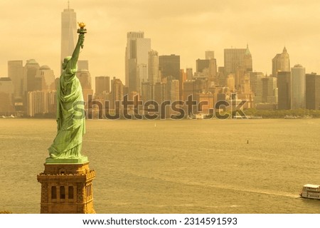 New York Statue of Liberty orange smog toxic air Royalty-Free Stock Photo #2314591593