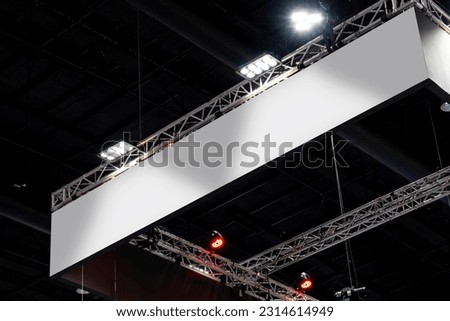 Hanging white indoor billboard with spot light