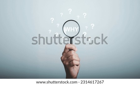 Why question in magnifying and question mark be around, What is your reason concept. Business answer and analysis, problem ask, interrogation, research information with copy space on grey background. Royalty-Free Stock Photo #2314617267