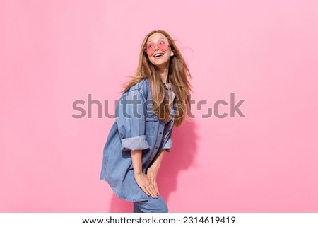 Photo portrait of pretty young teen girl posing defile shopping promo dressed stylish denim outfit isolated on pink color background