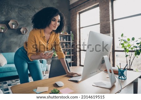 Photo of pretty sweet lady investor wear shirt communicating modern devices indoors workplace workstation