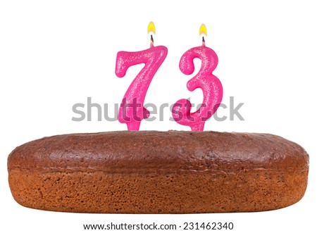 birthday cake with candles number 73 isolated on white background