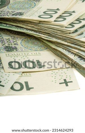 A large stack of Polish 100 zloty banknotes on a white background.  Synonymous with wealth and abundance Royalty-Free Stock Photo #2314624293