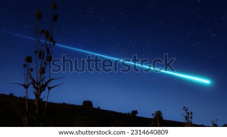Meteor trail above the horizon. Long tail of a meteor in the sky. Beautiful shooting star.