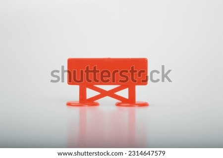 Black red plastic sign isolated on a white background. Copy space for the text.