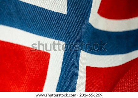 Closeup photo of a red white and blue norwegian flag.