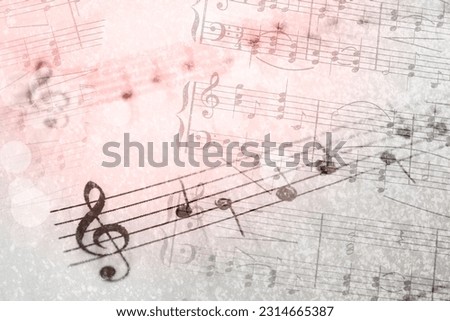 Sheets with music notes as background, double exposure. Bokeh and color tone effects