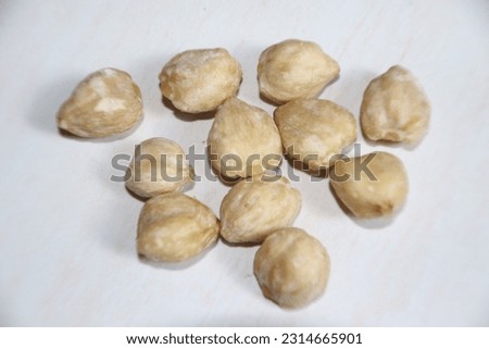 Picture of a group of pecan spices on a white background