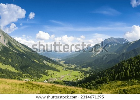 Valley Between the Mountains in Sunlight