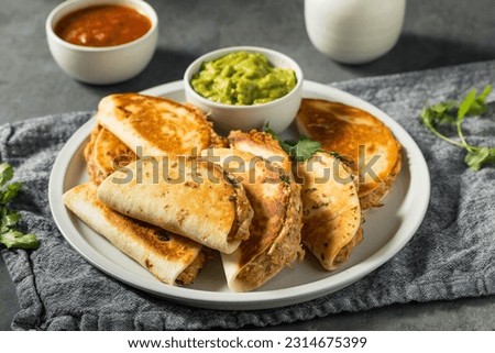 Homemade Mini Chicken Quesadillas with Salsa and Guac Royalty-Free Stock Photo #2314675399