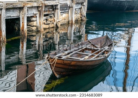 wooden boat in a peaceful landscape in the City Ålesund in Norway