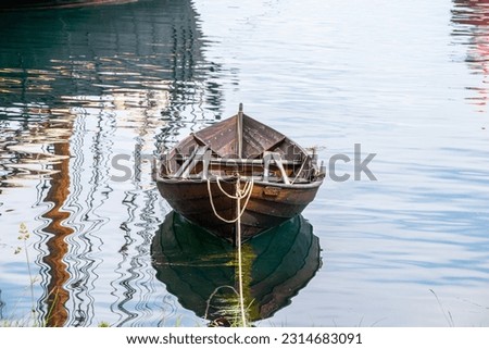 wooden boat in a peaceful landscape in the City Ålesund in Norway Royalty-Free Stock Photo #2314683091