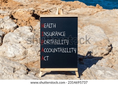 HIPAA symbol. Concept words HIPAA health insurance portability accountability act on blackboard. Beautiful stone background. Business HIPAA health insurance portability accountability act concept.