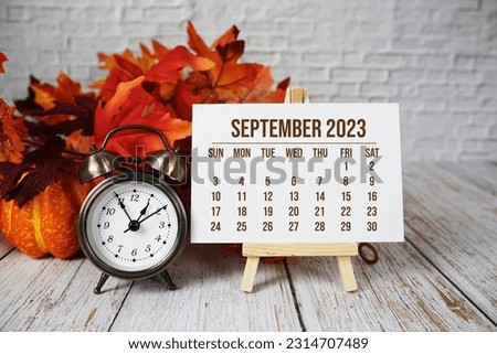 September 2023 monthly calendar maple leaf decoration on wooden background Royalty-Free Stock Photo #2314707489
