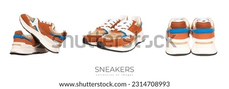 Pair of new unbranded brown shoes or sneakers in male hand isolated on white background with clipping path. High quality photo