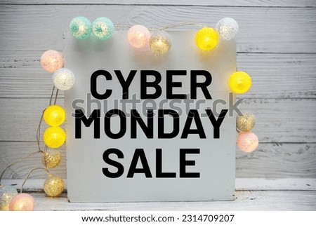 Cyber Monday Sale text message decoration with LED cotton balls on wooden background
