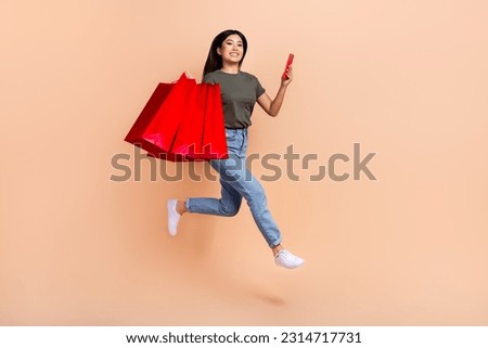 Full length size cadre of shopaholic funny girl run red bargains shopping store online boutique order isolated on beige color background