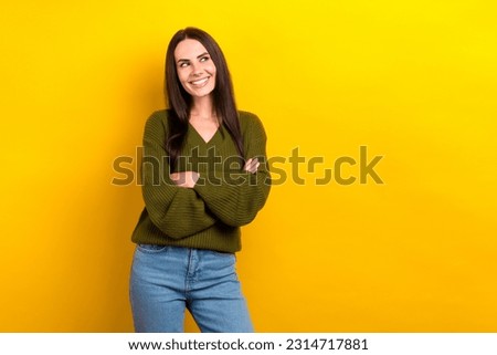 Photo of pretty cheerful minded lady crossed hands look empty space isolated on yellow color background