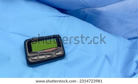 Pager symbolizes instant communication, efficiency, connection, and the era of reliable wireless messaging and urgent notifications Royalty-Free Stock Photo #2314723981