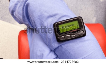 Pager symbolizes instant communication, efficiency, connection, and the era of reliable wireless messaging and urgent notifications Royalty-Free Stock Photo #2314723983
