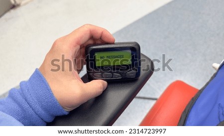 Pager symbolizes instant communication, efficiency, connection, and the era of reliable wireless messaging and urgent notifications Royalty-Free Stock Photo #2314723997