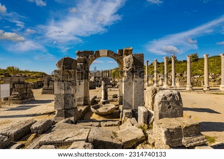 Rows of columns in Perge, Antalya, Turkey. Remains of colonnaded street in Pamphylian ancient city. Royalty-Free Stock Photo #2314740133