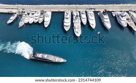 Aerial drone photo of beautiful yacht manoeuvring inside round port of Zea or Passalimani a safe anchorage in seaside area of Piraeus, Attica, Greece Royalty-Free Stock Photo #2314744109