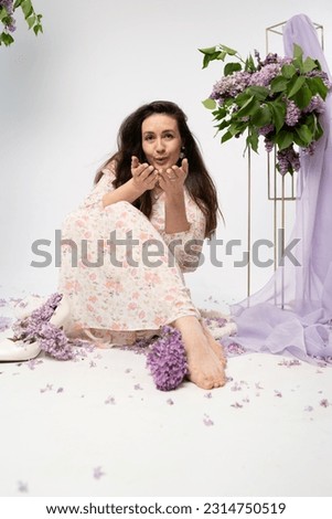 a series of photos of a girl in a dress with lilacs