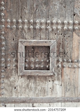 Old door cultural patrimony historical monument wood Royalty-Free Stock Photo #2314757209