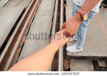 two hands walking hand in hand Travel everywhere, have each other, take care of each other along the way. good relationship