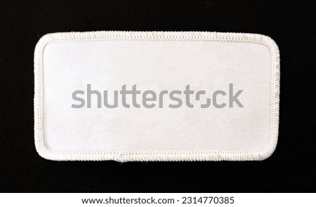 White rectangular patch with white trim and rounded corners. Royalty-Free Stock Photo #2314770385